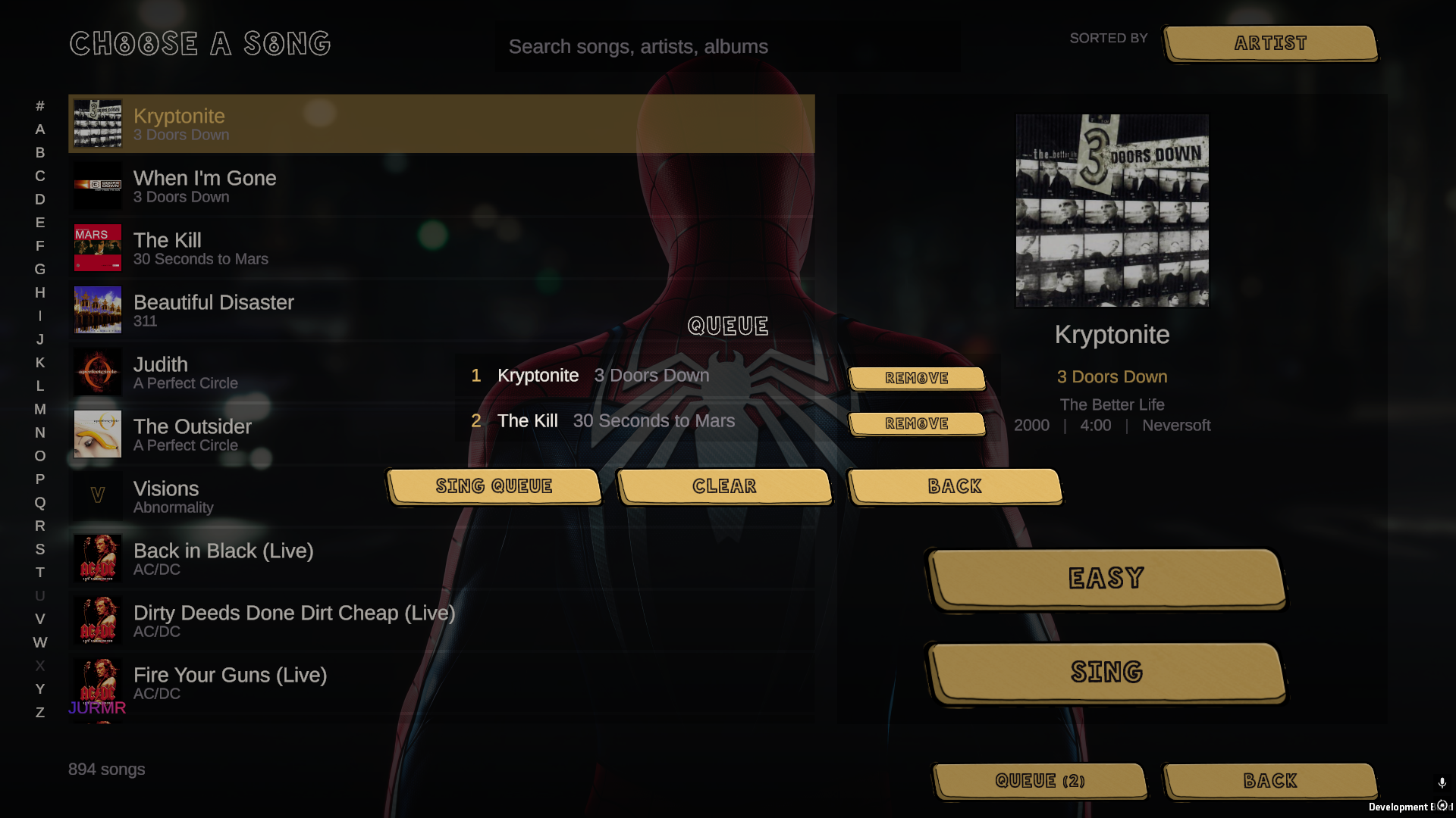 The song browser with the queue overlay open, showing two songs lined up and the song count at the foot of the list.